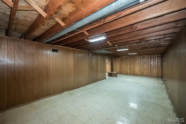 525 Angelus Dr, Florissant, MO 63031 - finished below grade area with tile patterned floors and wood walls