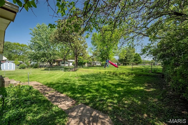 525 Angelus Dr, Florissant, MO 63031 - view of yard featuring a storage shed and an outdoor structure