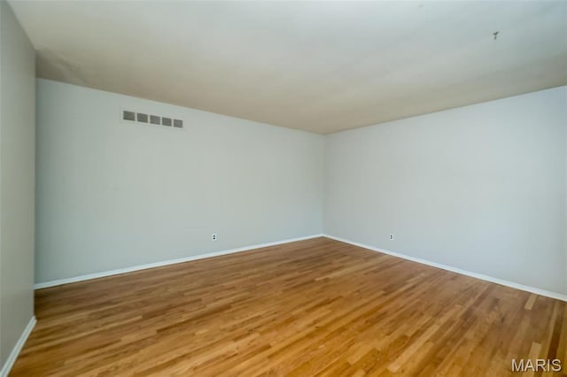 525 Angelus Dr, Florissant, MO 63031 - spare room featuring light wood-type flooring and baseboards
