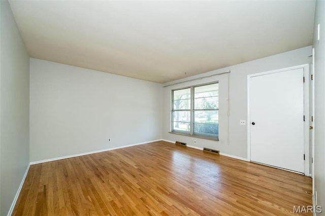525 Angelus Dr, Florissant, MO 63031 - unfurnished room featuring light wood-style floors and baseboards