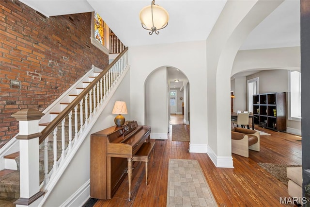 2612 S Compton Ave, Saint Louis, MO 63118 - entryway featuring arched walkways, hardwood / wood-style floors, and stairway