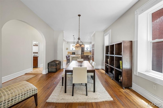 2612 S Compton Ave, Saint Louis, MO 63118 - dining space with hardwood / wood-style floors and arched walkways