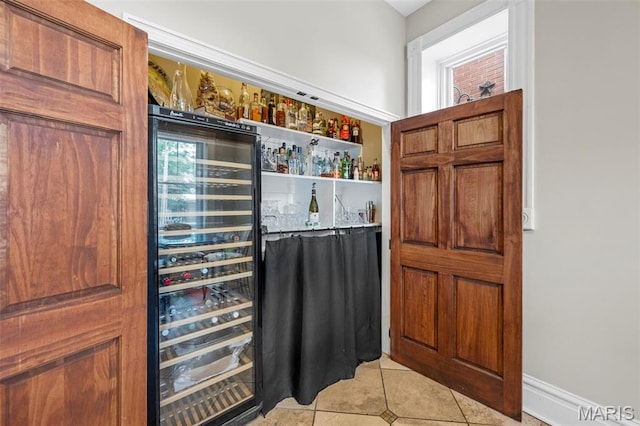 2612 S Compton Ave, Saint Louis, MO 63118 - indoor dry bar with wine cooler and light tile patterned floors