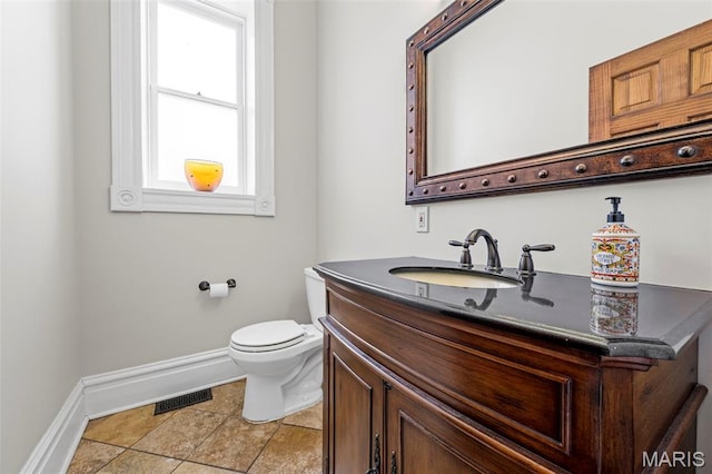 2612 S Compton Ave, Saint Louis, MO 63118 - half bath with baseboards and vanity