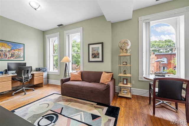 2612 S Compton Ave, Saint Louis, MO 63118 - home office featuring light wood-style flooring and baseboards