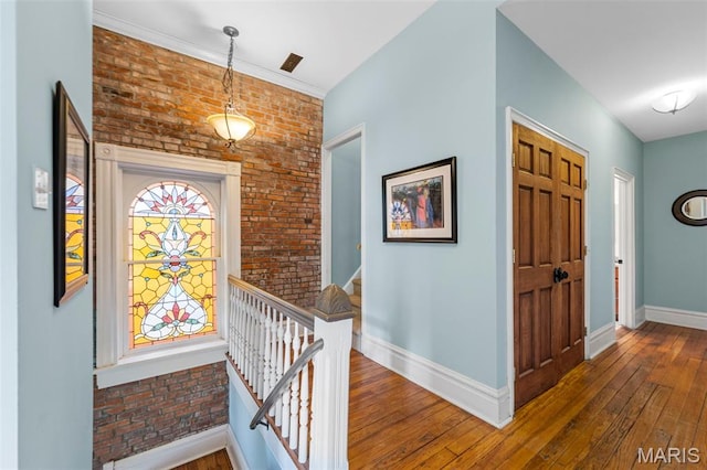2612 S Compton Ave, Saint Louis, MO 63118 - foyer entrance featuring wood-type flooring and brick wall