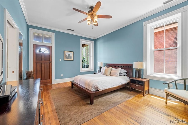 2612 S Compton Ave, Saint Louis, MO 63118 - bedroom with hardwood / wood-style floors, crown molding, and a ceiling fan