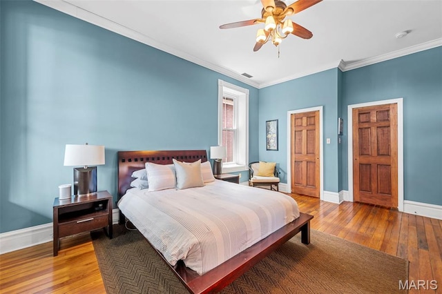 2612 S Compton Ave, Saint Louis, MO 63118 - bedroom featuring wood-type flooring, crown molding, and ceiling fan