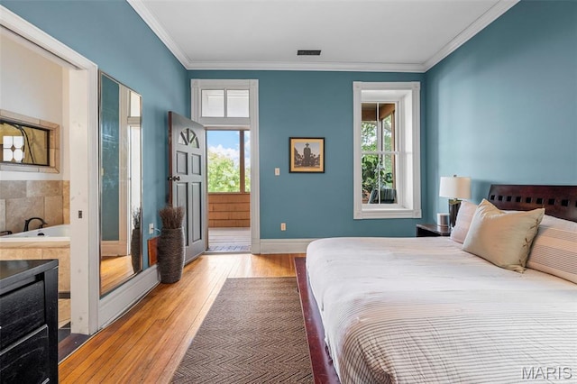 2612 S Compton Ave, Saint Louis, MO 63118 - bedroom featuring wood-type flooring and crown molding