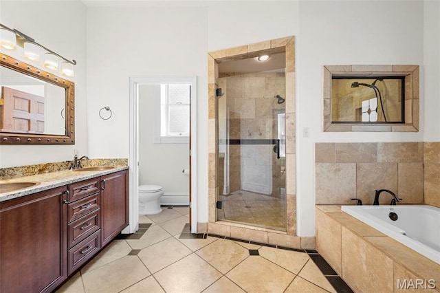 2612 S Compton Ave, Saint Louis, MO 63118 - bathroom with a stall shower, double vanity, a bath, and tile patterned flooring