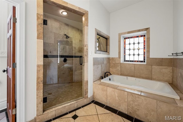 2612 S Compton Ave, Saint Louis, MO 63118 - bathroom with a bath, a stall shower, and tile patterned flooring