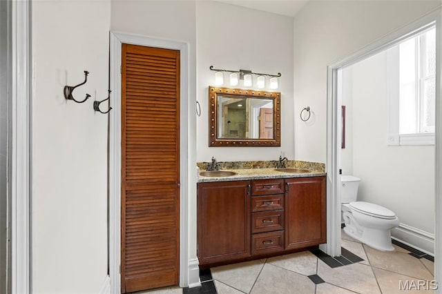 2612 S Compton Ave, Saint Louis, MO 63118 - full bathroom with double vanity and tile patterned flooring