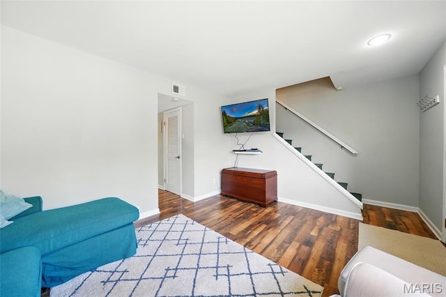 10566 Carroll Wood Way, Saint Louis, MO 63128 - living room with stairs, baseboards, and wood finished floors