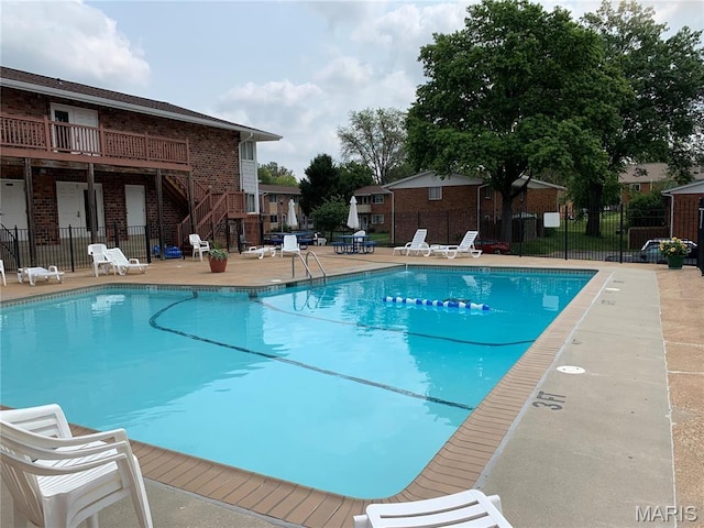 10566 Carroll Wood Way, Saint Louis, MO 63128 - community pool featuring a patio area and stairway