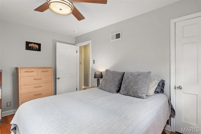 7337 Bruno Ave, Richmond Heights, MO 63117 - bedroom featuring wood finished floors, baseboards, and ceiling fan