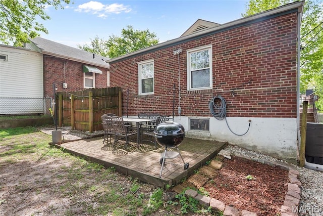 7337 Bruno Ave, Richmond Heights, MO 63117 - rear view of house featuring brick siding, fence, and a patio area