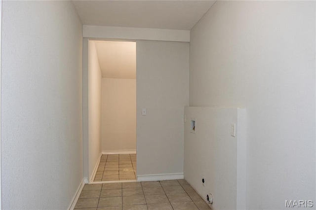 laundry area featuring hookup for a washing machine and light tile patterned floors