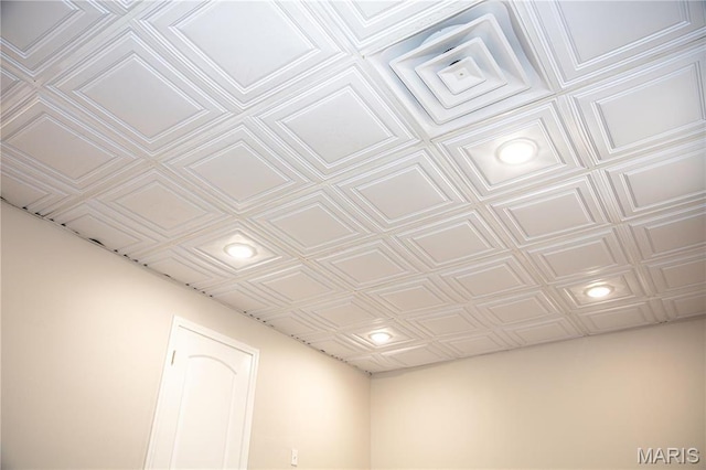 detailed view of an ornate ceiling and recessed lighting