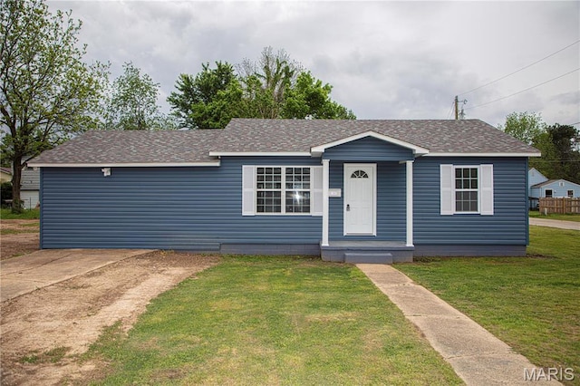 1042 Ash St, Poplar Bluff, MO 63901 - view of front of house featuring a shingled roof and a front yard