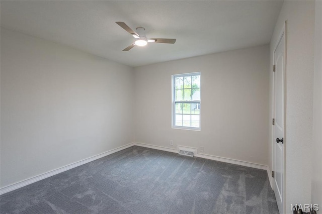 1042 Ash St, Poplar Bluff, MO 63901 - spare room with dark carpet, ceiling fan, and baseboards