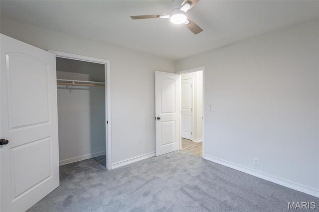 1042 Ash St, Poplar Bluff, MO 63901 - unfurnished bedroom featuring carpet, baseboards, a closet, and ceiling fan