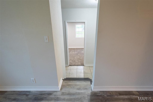1042 Ash St, Poplar Bluff, MO 63901 - hallway featuring baseboards and wood finished floors
