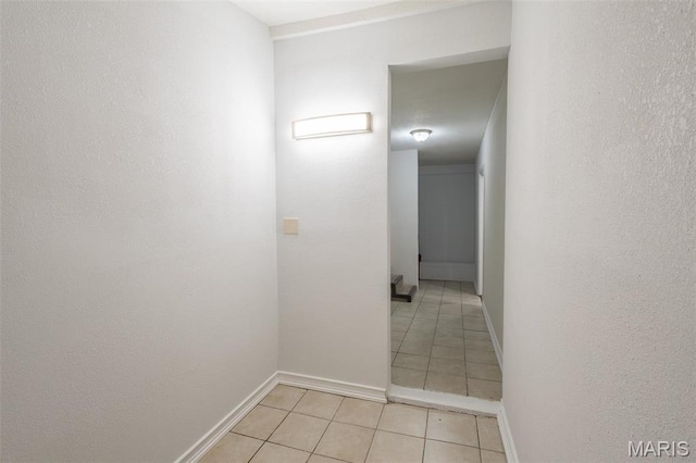 1042 Ash St, Poplar Bluff, MO 63901 - hallway featuring light tile patterned floors and baseboards