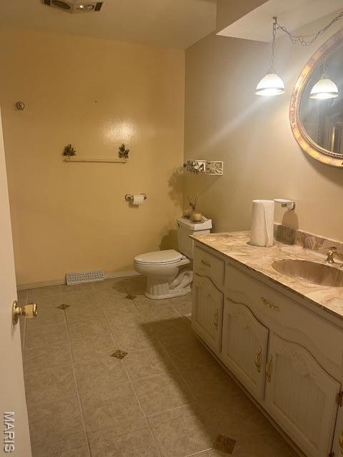 3106 Mimosa St, Cape Girardeau, MO 63701 - bathroom with vanity, tile patterned flooring, and toilet
