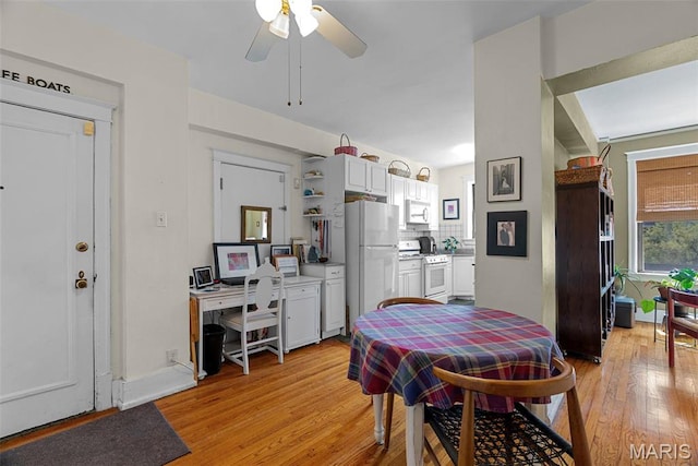 4501 Maryland Ave Unit 603, Saint Louis, MO 63108 - dining area featuring light wood finished floors and a ceiling fan