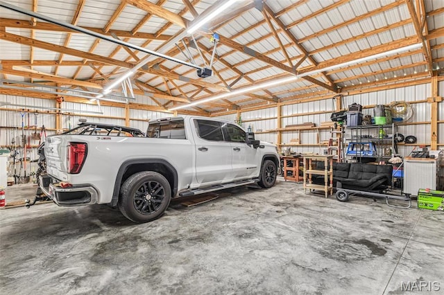 5259 US Highway 61, Bloomsdale, MO 63627 - garage with a garage door opener and metal wall