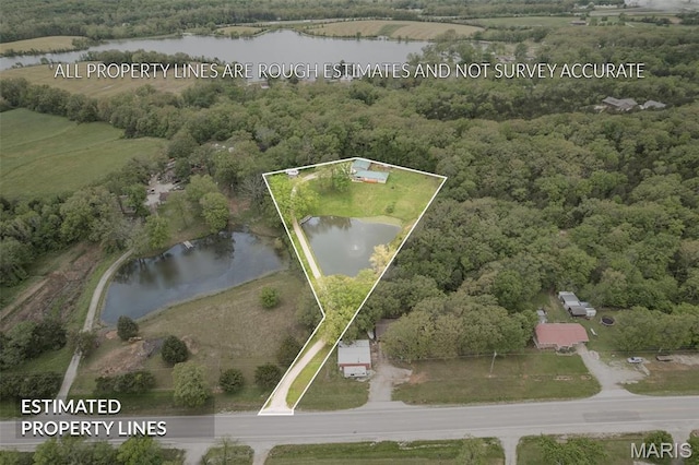 5259 US Highway 61, Bloomsdale, MO 63627 - aerial view of property and surrounding area featuring a large body of water, property boundaries highlighted, and a heavily wooded area