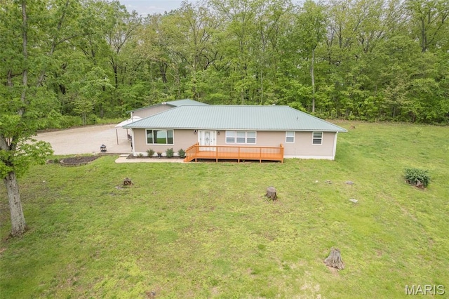 5259 US Highway 61, Bloomsdale, MO 63627 - view of front of house featuring a front lawn, a deck, metal roof, and a wooded view