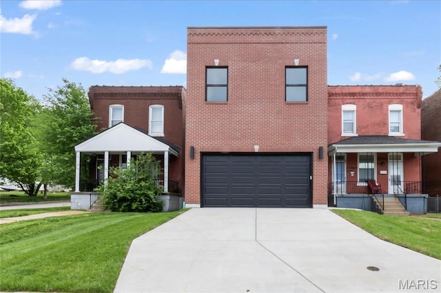2734 S 59th St, Saint Louis, MO 63139 - view of front of home with a front yard, driveway, a garage, and a porch