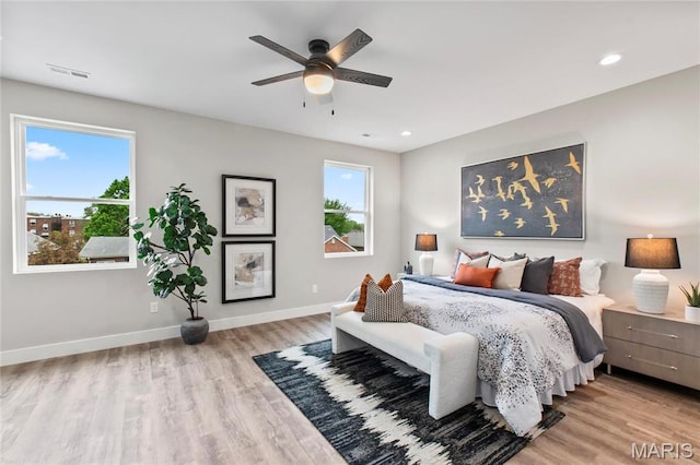 2734 S 59th St, Saint Louis, MO 63139 - bedroom featuring multiple windows, wood finished floors, baseboards, recessed lighting, and a ceiling fan
