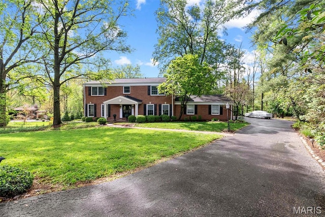 19 Sackston Woods Ln, Saint Louis, MO 63141 - colonial inspired home featuring brick siding and a front lawn