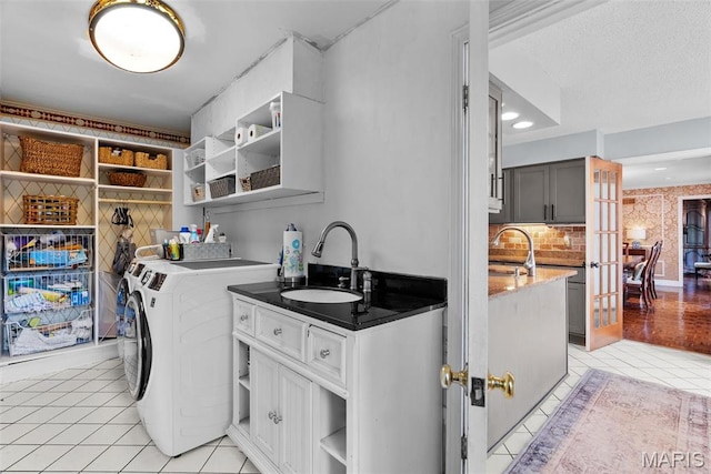 19 Sackston Woods Ln, Saint Louis, MO 63141 - clothes washing area featuring washer and dryer, light tile patterned floors, and french doors