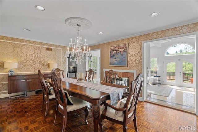 19 Sackston Woods Ln, Saint Louis, MO 63141 - dining space featuring wallpapered walls, a chandelier, ornamental molding, baseboards, and french doors
