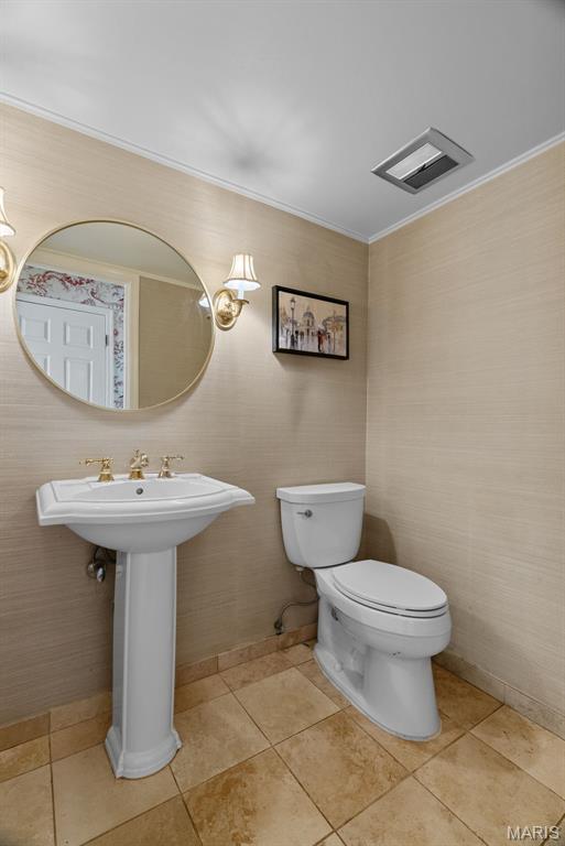 19 Sackston Woods Ln, Saint Louis, MO 63141 - bathroom featuring toilet, tile patterned flooring, and crown molding