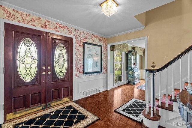 19 Sackston Woods Ln, Saint Louis, MO 63141 - entryway with stairway, healthy amount of natural light, wainscoting, crown molding, and wallpapered walls