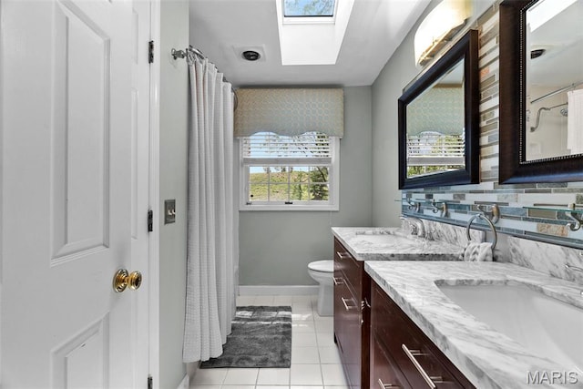 19 Sackston Woods Ln, Saint Louis, MO 63141 - full bath with vanity, tile patterned flooring, a skylight, toilet, and baseboards