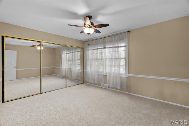 19 Sackston Woods Ln, Saint Louis, MO 63141 - unfurnished bedroom featuring carpet floors, a closet, baseboards, and a ceiling fan