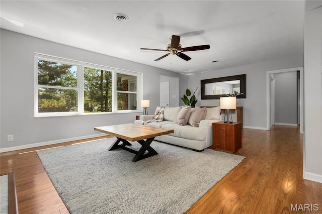 1345 Cheshire Ln, Webster Groves, MO 63119 - living room with a ceiling fan, wood finished floors, and baseboards