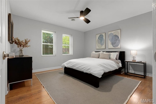 1345 Cheshire Ln, Webster Groves, MO 63119 - bedroom featuring wood finished floors, baseboards, and ceiling fan
