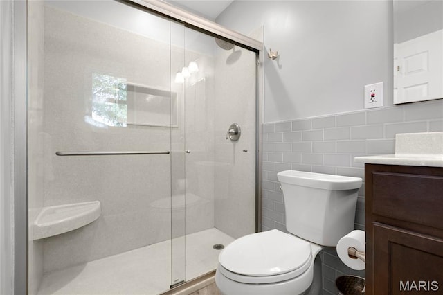 1345 Cheshire Ln, Webster Groves, MO 63119 - full bath with vanity, toilet, a shower stall, tile walls, and a wainscoted wall