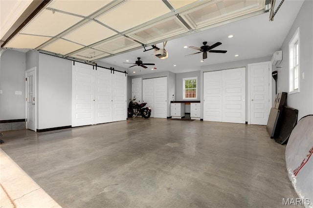 1345 Cheshire Ln, Webster Groves, MO 63119 - garage featuring a garage door opener, a wall mounted AC, recessed lighting, and a ceiling fan