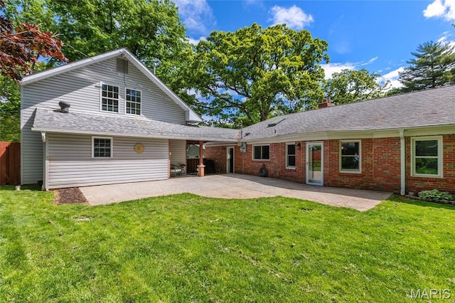 1345 Cheshire Ln, Webster Groves, MO 63119 - rear view of property featuring a patio area, a lawn, and brick siding