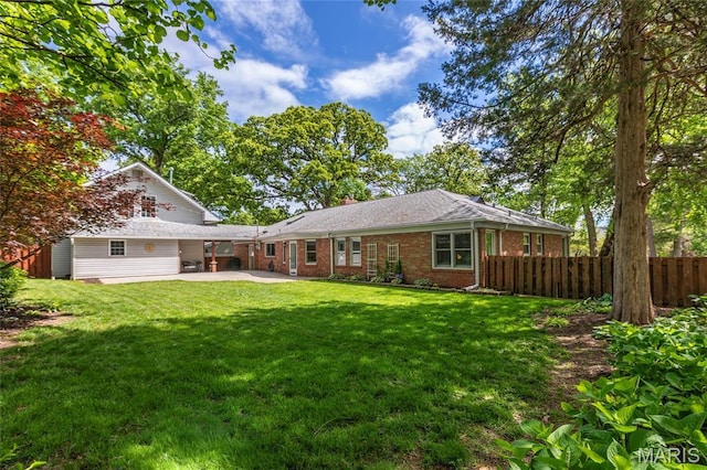 1345 Cheshire Ln, Webster Groves, MO 63119 - rear view of house featuring brick siding, a patio, and a chimney