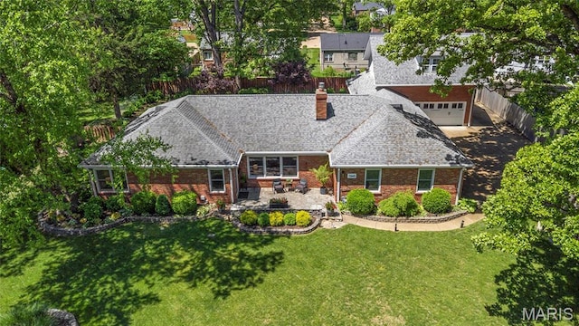 1345 Cheshire Ln, Webster Groves, MO 63119 - back of property featuring a chimney, a garage, brick siding, and roof with shingles
