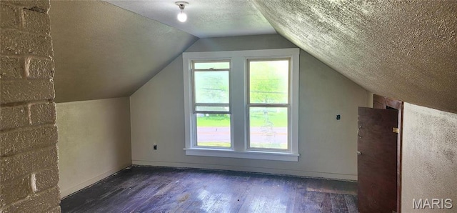 2311 State St, Chester, IL 62233 - bonus room featuring hardwood / wood-style floors, plenty of natural light, lofted ceiling, a textured ceiling, and baseboards