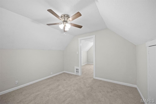 315 Meister St, Collinsville, IL 62234 - additional living space with carpet flooring, lofted ceiling, baseboards, ceiling fan, and a textured ceiling
